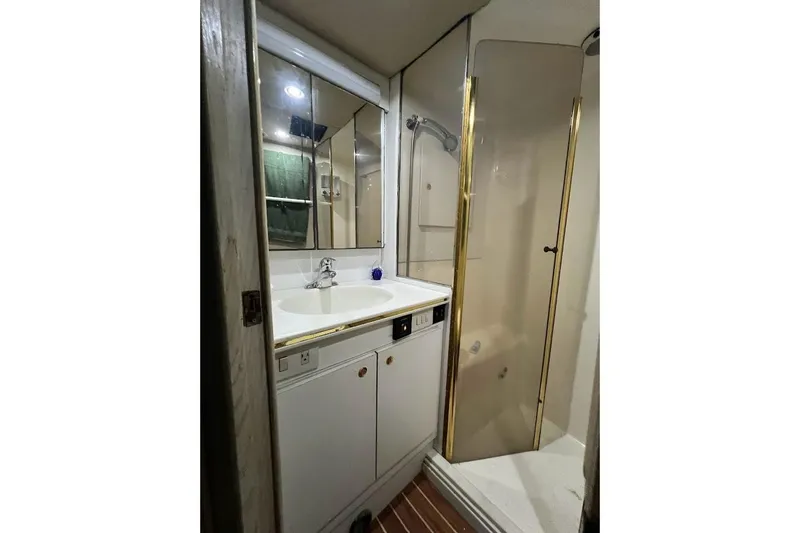 Our Trade II Yacht Photos Pics Bathroom interior of 1996 Ocean Yachts 48 Super Sport with shower and vanity.