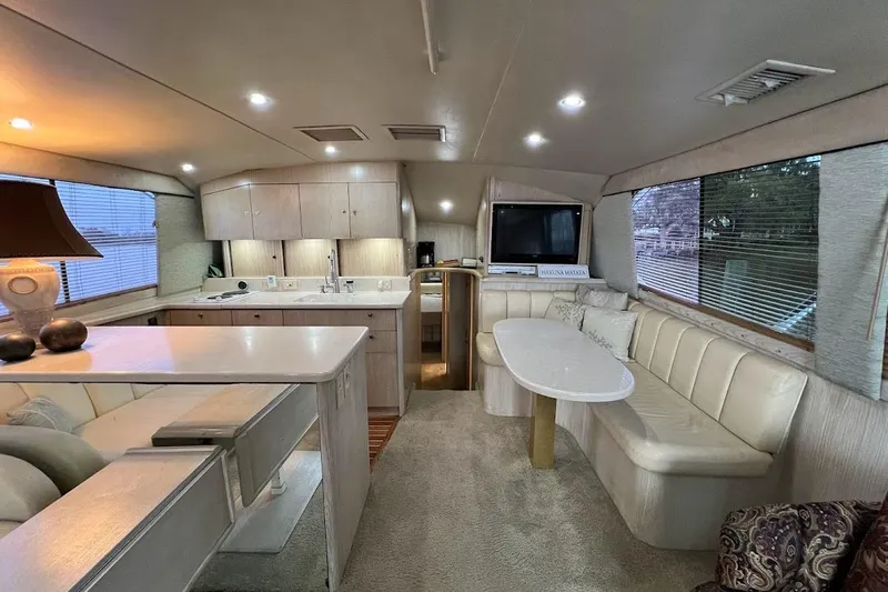 Our Trade II Yacht Photos Pics Luxurious interior of 1996 Ocean Yachts 48 Super Sport with elegant seating and modern amenities.