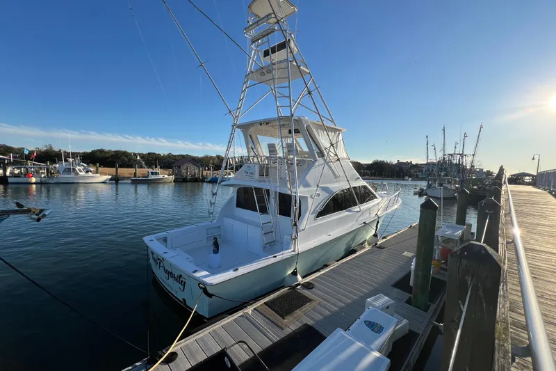 Our Trade II Yacht Photos Pics 1996 Ocean Yachts 48 Super Sport docked at marina under clear blue sky.