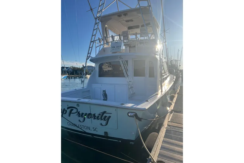 Our Trade II Yacht Photos Pics 1996 Ocean Yachts 48 Super Sport docked in Charleston, SC, with "For Sale" sign.