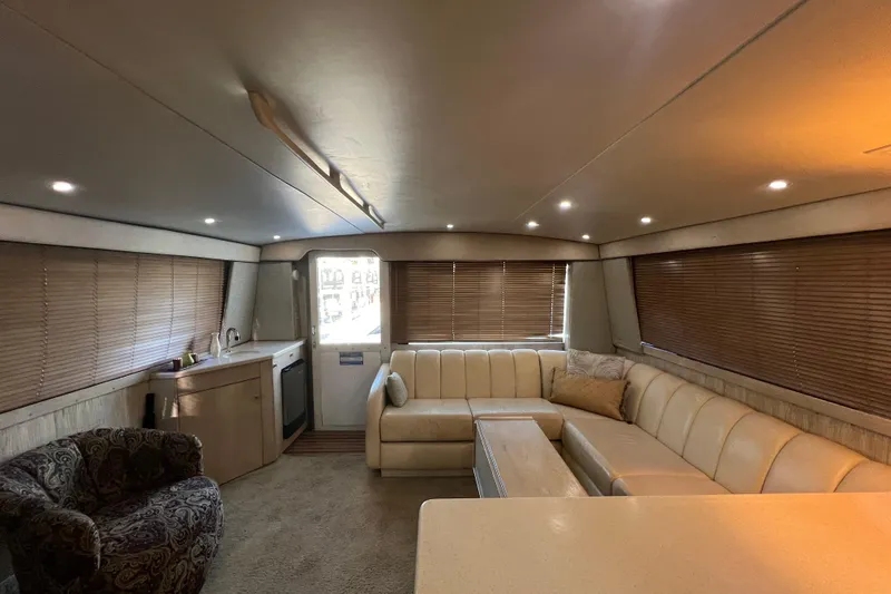 Our Trade II Yacht Photos Pics Luxurious interior of a 1996 Ocean Yachts 48 Super Sport with plush seating and modern amenities.