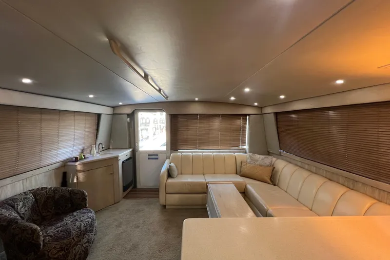 Our Trade II Yacht Photos Pics Luxurious interior of 1996 Ocean Yachts 48 Super Sport with plush seating and modern amenities.