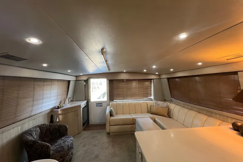 Our Trade II Yacht Photos Pics Luxurious interior of 1996 Ocean Yachts 48 Super Sport with plush seating and modern lighting.