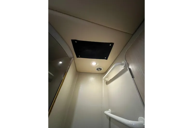 Our Trade II Yacht Photos Pics Ceiling view of 1996 Ocean Yachts 48 Super Sport interior with lighting and handrails.