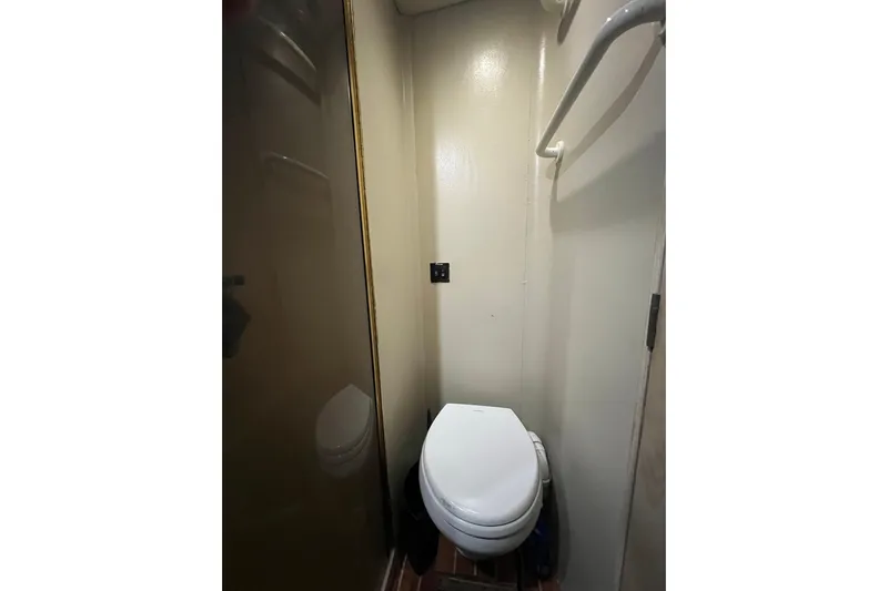 Our Trade II Yacht Photos Pics 1996 Ocean Yachts 48 Super Sport bathroom with toilet and shower area.