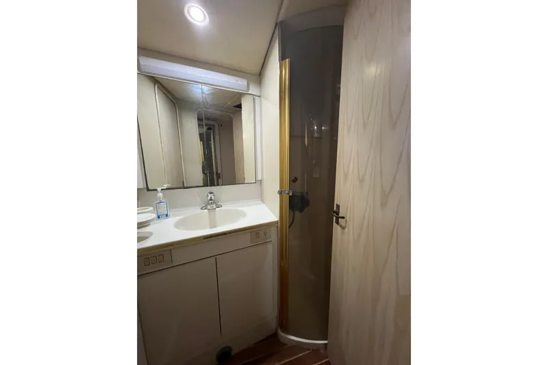 Our Trade II Yacht Photos Pics Bathroom interior of 1996 Ocean Yachts 48 Super Sport with sink and shower.