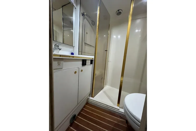 Our Trade II Yacht Photos Pics Bathroom interior of 1996 Ocean Yachts 48 Super Sport with shower and vanity.