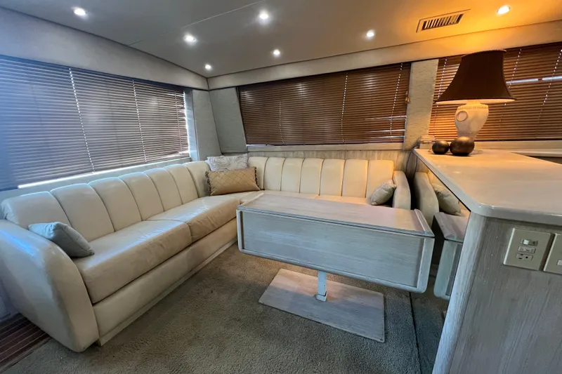 Our Trade II Yacht Photos Pics Luxurious interior of 1996 Ocean Yachts 48 Super Sport with plush seating and elegant decor.