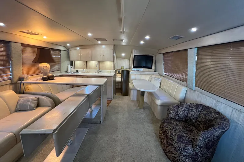 Our Trade II Yacht Photos Pics Luxurious interior of 1996 Ocean Yachts 48 Super Sport with modern furnishings and ambient lighting.