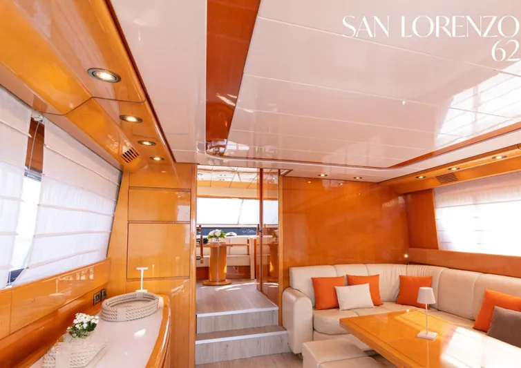  Yacht Photos Pics Luxurious interior of 1998 Sanlorenzo 62 yacht with elegant wood finishes and cozy seating.