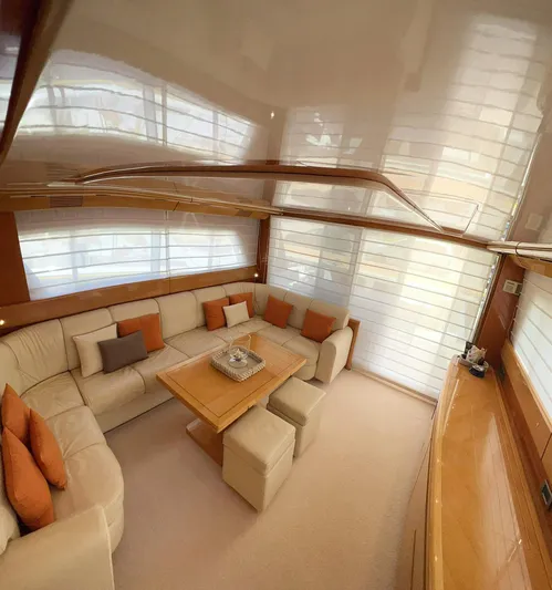  Yacht Photos Pics Luxurious interior of a 1998 Sanlorenzo 62 yacht with elegant seating and modern decor.