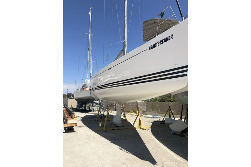 Heartbreaker Yacht Photos Pics 2011 X-Yachts X-55 sailboat named "Heartbreaker" on dry dock, side view.