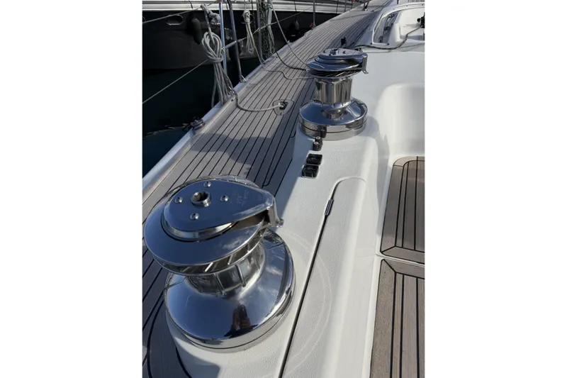 Heartbreaker Yacht Photos Pics Polished winches on 2011 X-Yachts X-55 sailboat deck, showcasing sleek design and craftsmanship.