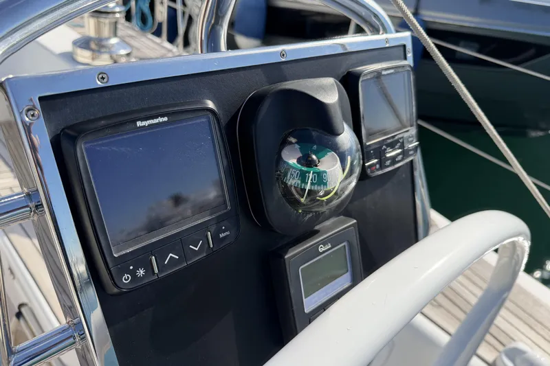 Heartbreaker Yacht Photos Pics Navigation instruments on a 2011 X-Yachts X-55 sailboat, featuring a compass and display screens.