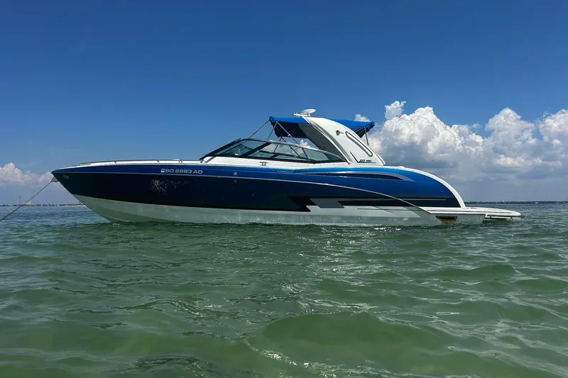  Yacht Photos Pics 2017 Formula 350 Crossover Bowrider on calm water under a clear blue sky.