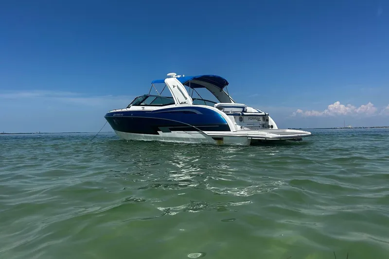  Yacht Photos Pics 2017 Formula 350 Crossover Bowrider on calm water under clear blue sky.