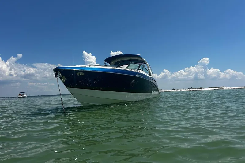  Yacht Photos Pics 2017 Formula 350 Crossover Bowrider on calm water under clear blue sky.