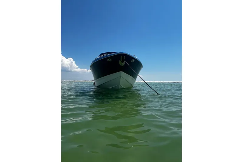  Yacht Photos Pics 2017 Formula 350 Crossover Bowrider anchored in clear water under blue sky.