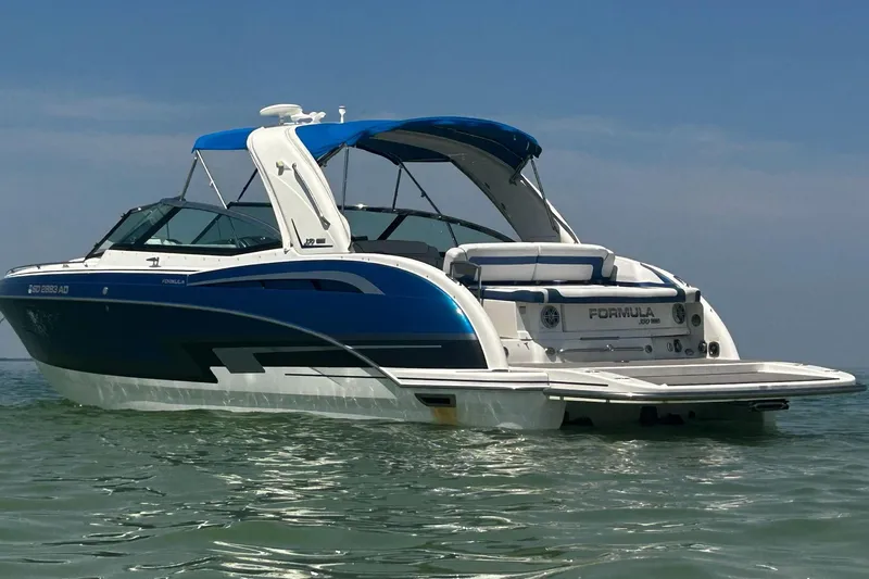 Yacht Photos Pics 2017 Formula 350 Crossover Bowrider in water, showcasing sleek design and blue accents.