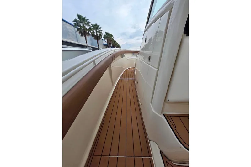  Yacht Photos Pics 2017 Scout 350 LXF boat deck with teak flooring and sleek design.