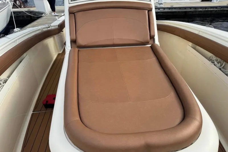  Yacht Photos Pics 2017 Scout 350 LXF boat with brown cushioned seating on deck.