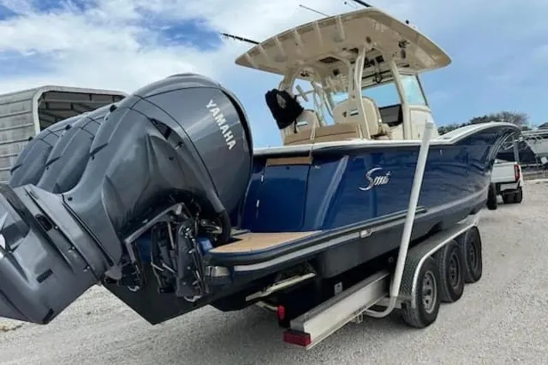  Yacht Photos Pics 2017 Scout 350 LXF boat with Yamaha engines on a trailer.