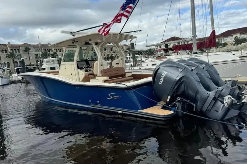  Yacht Photos Pics 2017 Scout 350 LXF boat with Yamaha engines docked at marina, American flag flying.