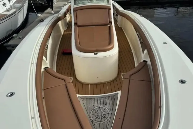  Yacht Photos Pics 2017 Scout 350 LXF boat interior with brown seating and wood flooring.