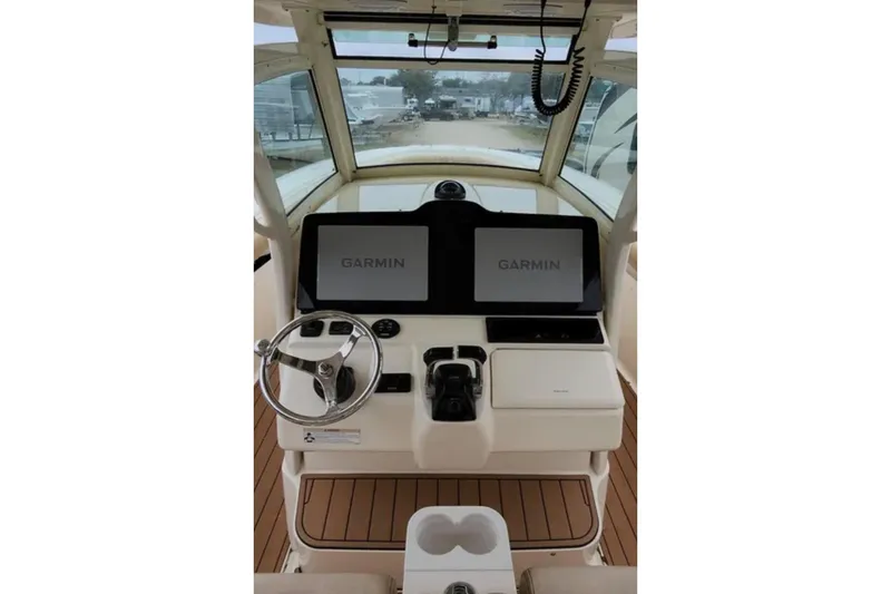  Yacht Photos Pics 2017 Scout 350 LXF boat helm with dual Garmin displays and steering wheel.