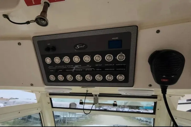  Yacht Photos Pics Control panel of a 2017 Scout 350 LXF boat with various switches and a microphone.