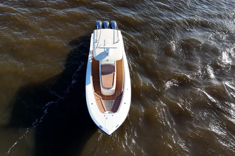  Yacht Photos Pics 2017 Scout 350 LXF boat on water, aerial view, showcasing sleek design and triple engines.