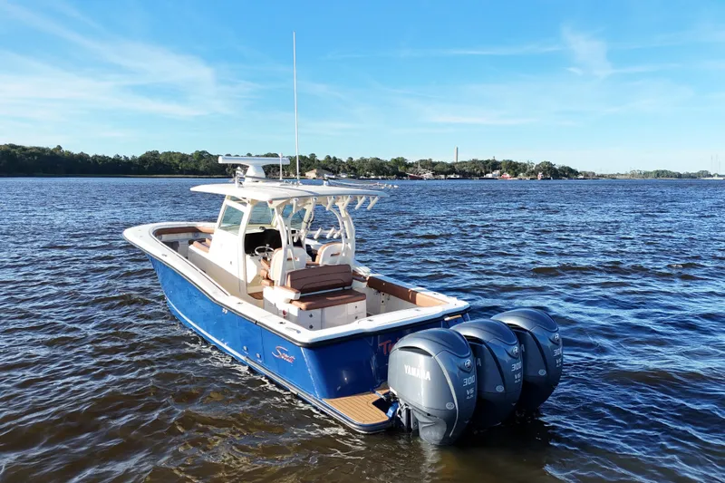  Yacht Photos Pics 2017 Scout 350 LXF boat with triple Yamaha engines on a sunny day.