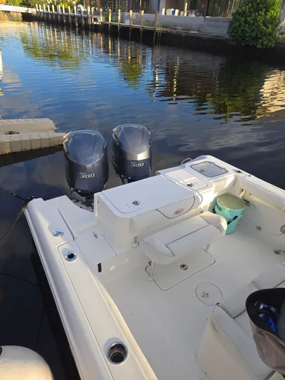 ___ Yacht Photos Pics 2018 Sea Hunt Gamefish 30 boat with twin 300 engines docked by calm waters.