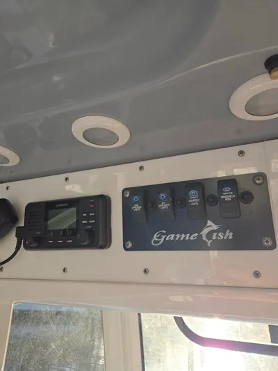 ___ Yacht Photos Pics Control panel of 2018 Sea Hunt Gamefish 30 with Garmin device and labeled switches.