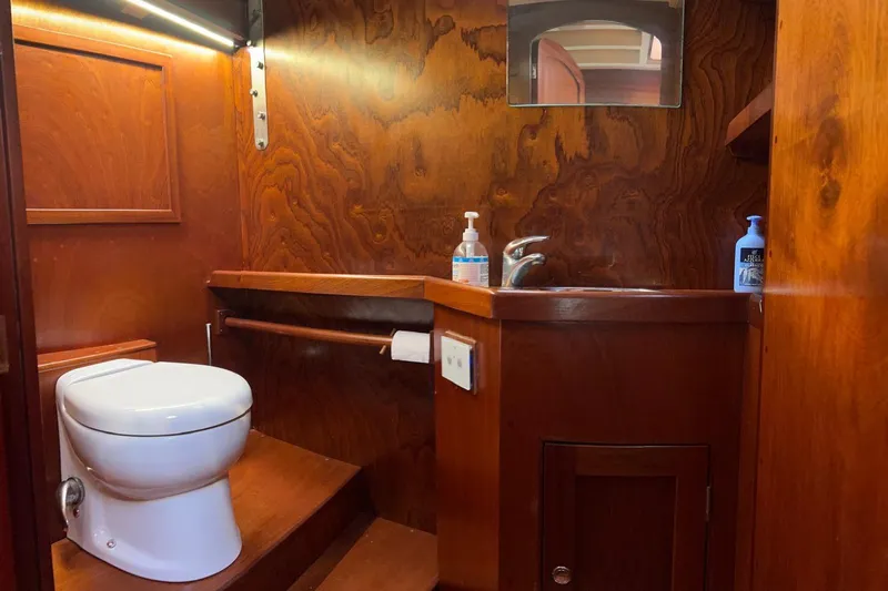 Aria Di Mare Yacht Photos Pics Luxurious wooden bathroom interior on a 2013 Custom Classic Yawl sailboat.