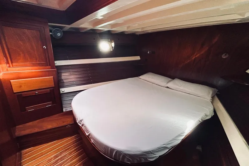 Aria Di Mare Yacht Photos Pics Cozy cabin interior of 2013 Custom Classic Yawl with wooden finish and comfortable bed.