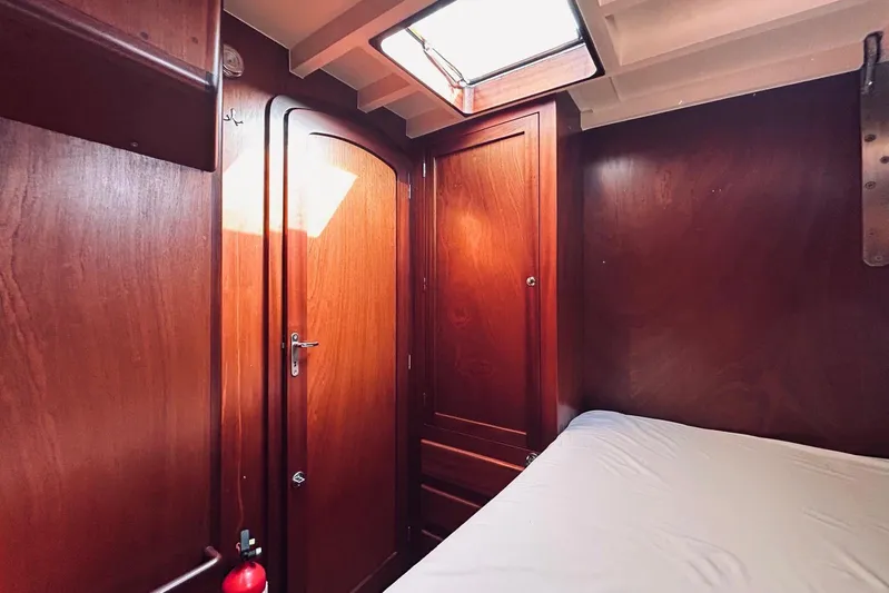 Aria Di Mare Yacht Photos Pics Cozy wooden cabin interior of 2013 Custom Classic Yawl with bed and skylight.