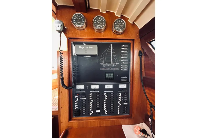 Aria Di Mare Yacht Photos Pics Control panel of a 2013 Custom Classic Yawl with Raymarine equipment and gauges.