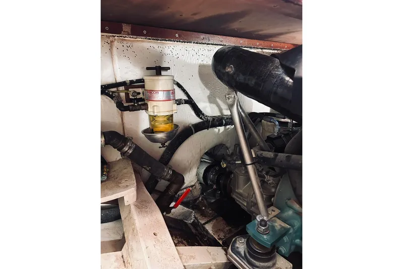 Aria Di Mare Yacht Photos Pics Engine compartment of 2013 Custom Classic Yawl with visible fuel filter and hoses.