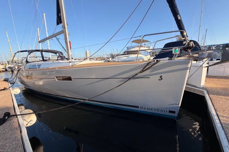 Bella Yacht Photos Pics 2017 Beneteau Oceanis 45 yacht docked in marina, side view.