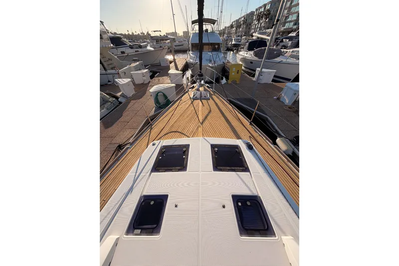 Bella Yacht Photos Pics Beneteau Oceanis 45 sailboat docked at marina, 2017 model, wooden deck view.