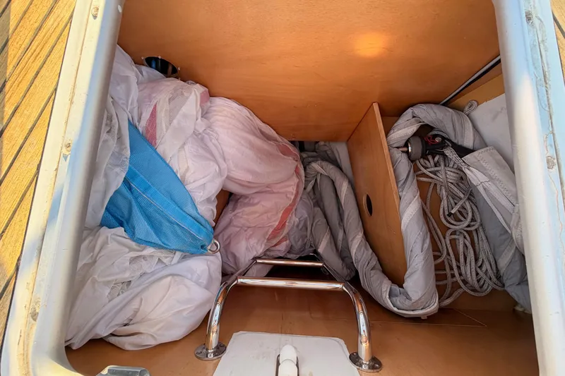 Bella Yacht Photos Pics Storage compartment of 2017 Beneteau Oceanis 45 sailboat with ropes and sails.