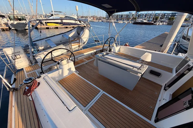 Bella Yacht Photos Pics 2017 Beneteau Oceanis 45 yacht with spacious teak deck at marina.
