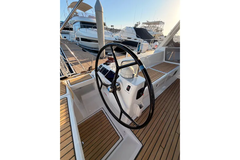 Bella Yacht Photos Pics Steering wheel of 2017 Beneteau Oceanis 45 yacht, docked at marina.