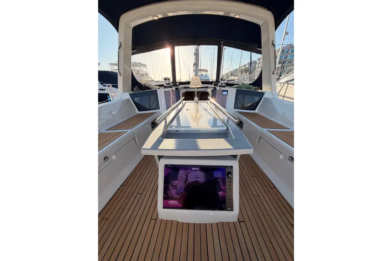 Bella Yacht Photos Pics 2017 Beneteau Oceanis 45 yacht cockpit with sleek design and wooden flooring.