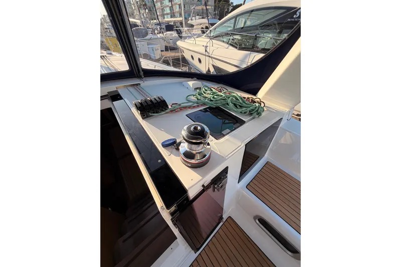 Bella Yacht Photos Pics Beneteau Oceanis 45 (2017) yacht deck with winch and ropes in marina.