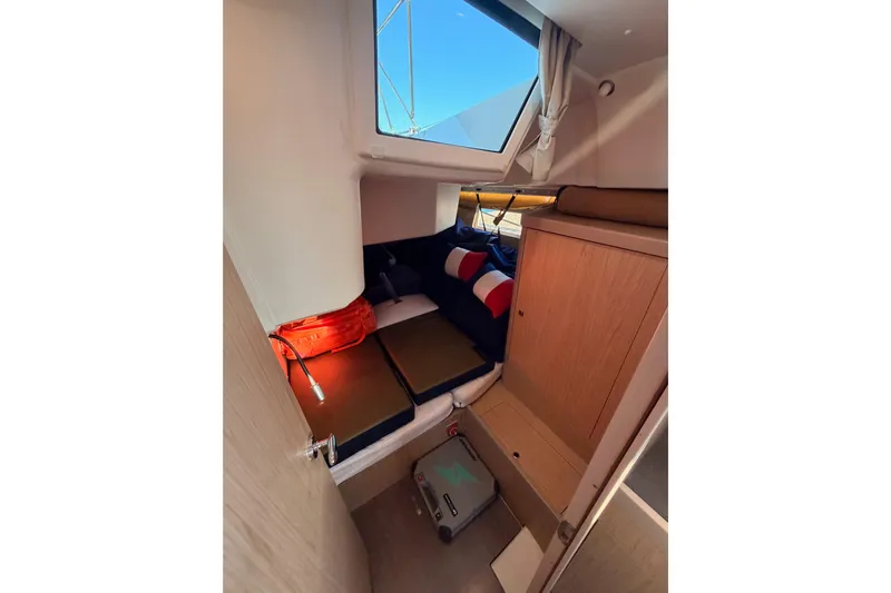 Bella Yacht Photos Pics Cozy cabin interior of 2017 Beneteau Oceanis 45 sailboat with window view.