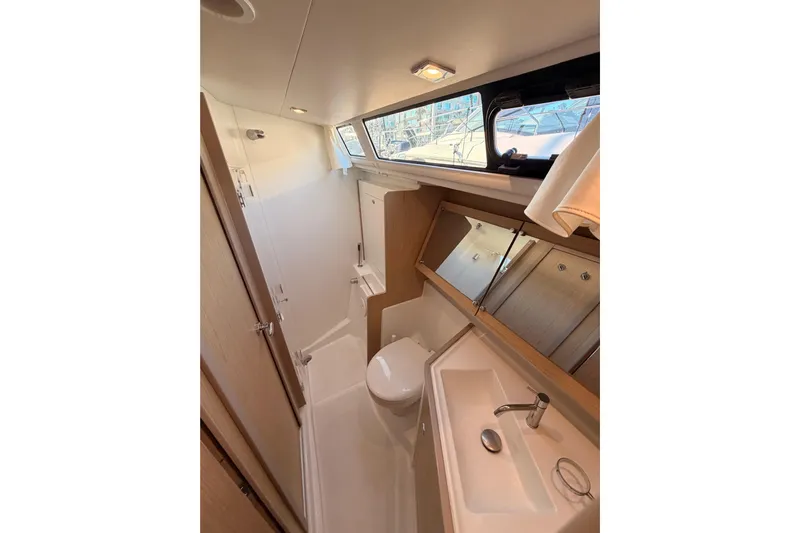 Bella Yacht Photos Pics Bathroom interior of 2017 Beneteau Oceanis 45 yacht, featuring modern fixtures and ample lighting.