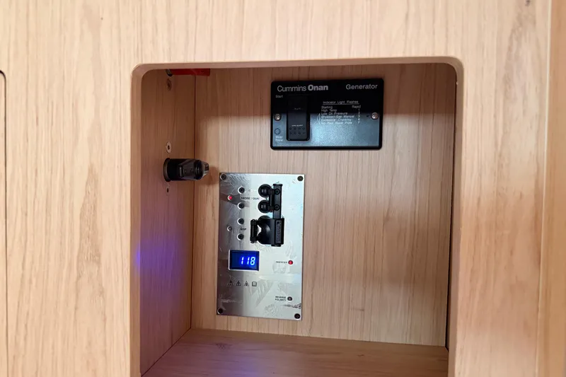 Bella Yacht Photos Pics Control panel inside 2017 Beneteau Oceanis 45 yacht, featuring Cummins Onan generator.