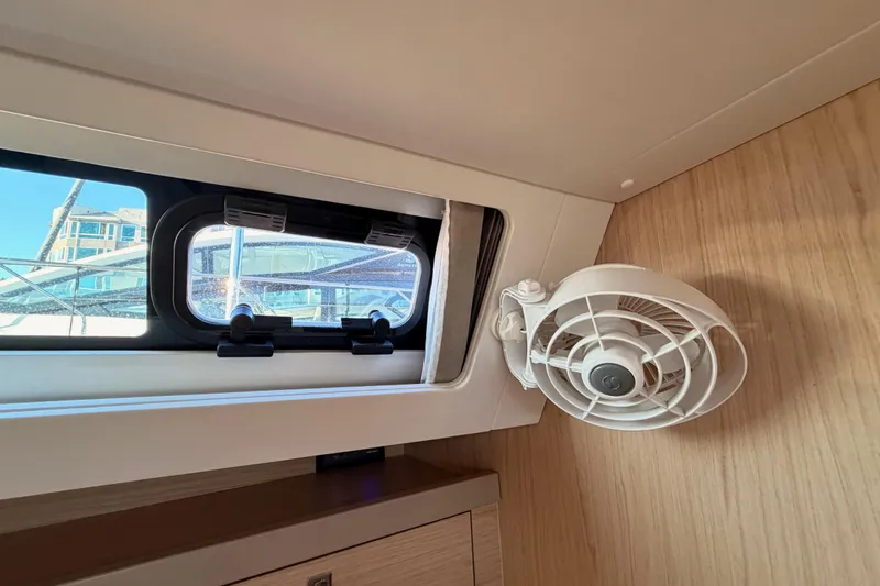Bella Yacht Photos Pics Interior of 2017 Beneteau Oceanis 45 yacht with window and fan.
